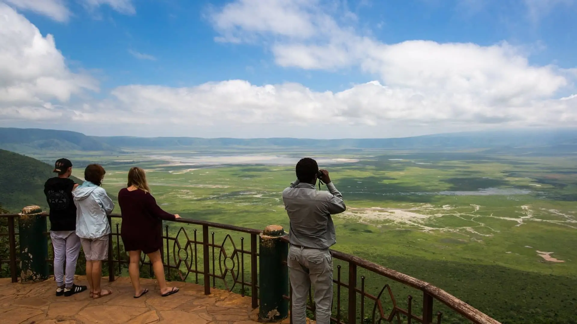 Aerial view of the Ngorongoro Crater floor with wildlife grazing across the grassland